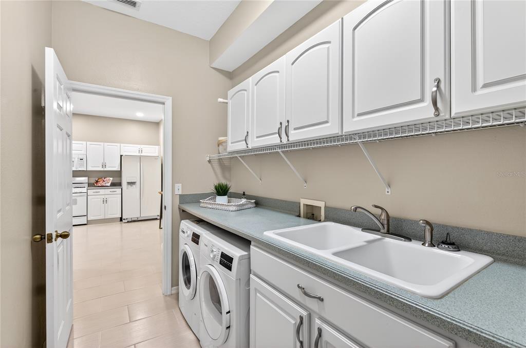1737 Sassafras Drive Wesley Chapel, FL 33543 - Photo 24 of 58 a view of a kitchen with sink and cabinets