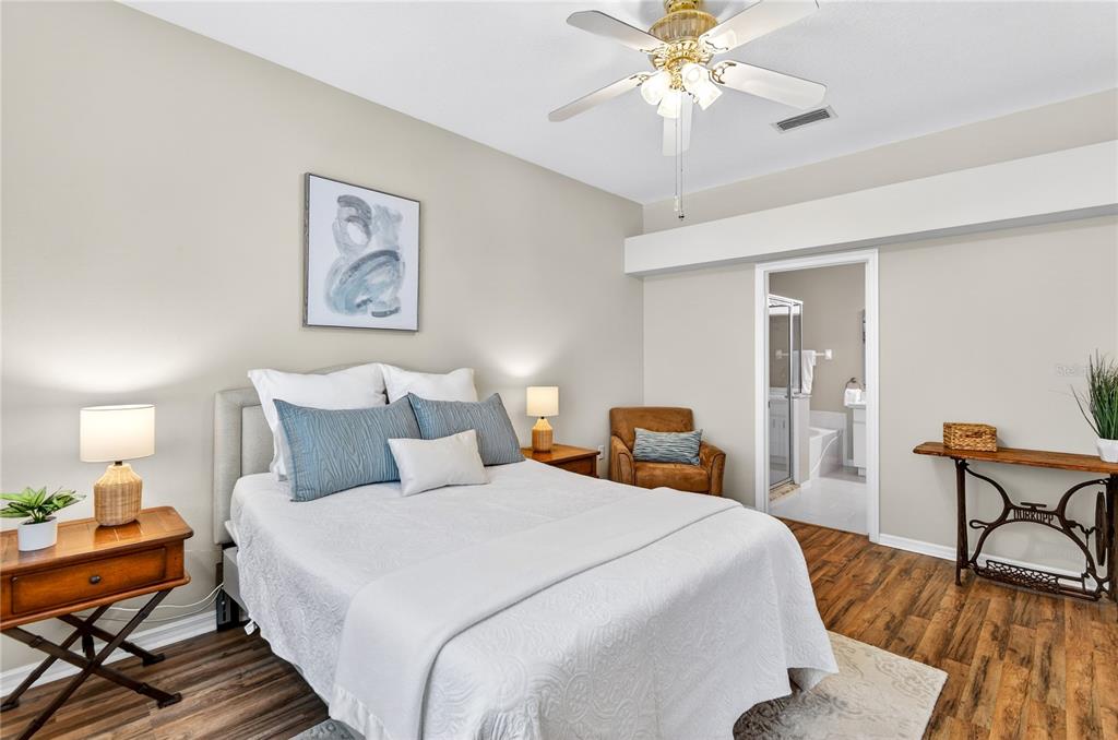 1737 Sassafras Drive Wesley Chapel, FL 33543 - Photo 31 of 58 a bedroom with bed and wooden floor