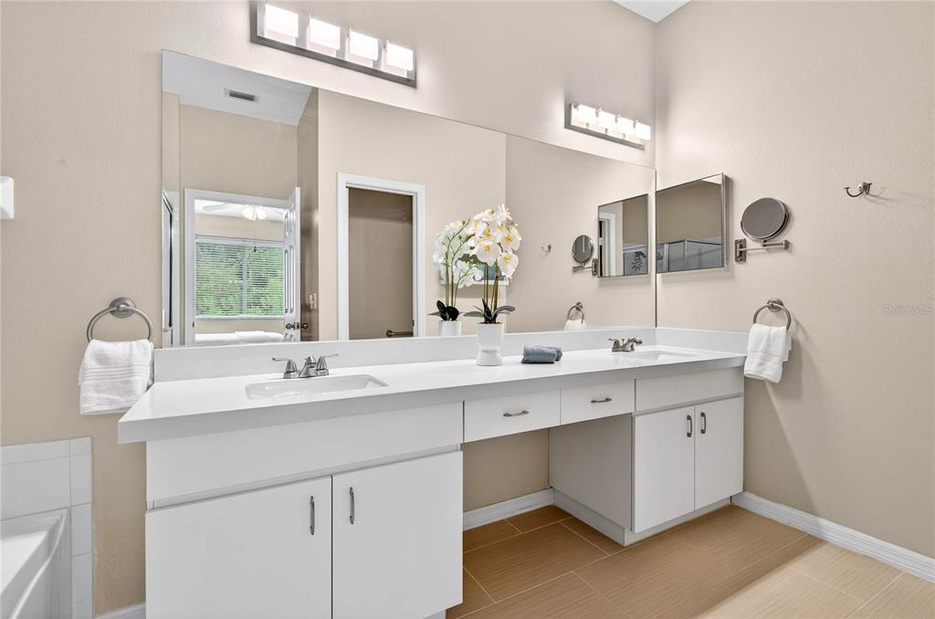 1737 Sassafras Drive Wesley Chapel, FL 33543 - Photo 33 of 58 a bathroom with a double vanity sink and a mirror