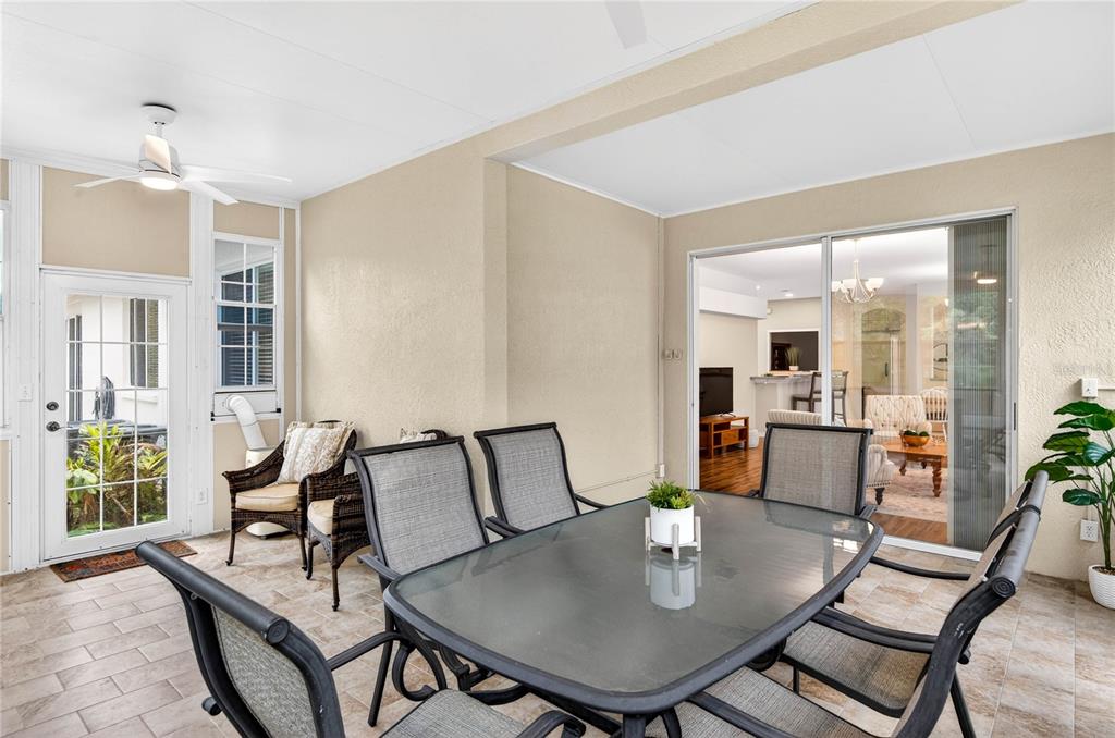 1737 Sassafras Drive Wesley Chapel, FL 33543 - Photo 37 of 58 a view of a dining room with furniture and wooden floor