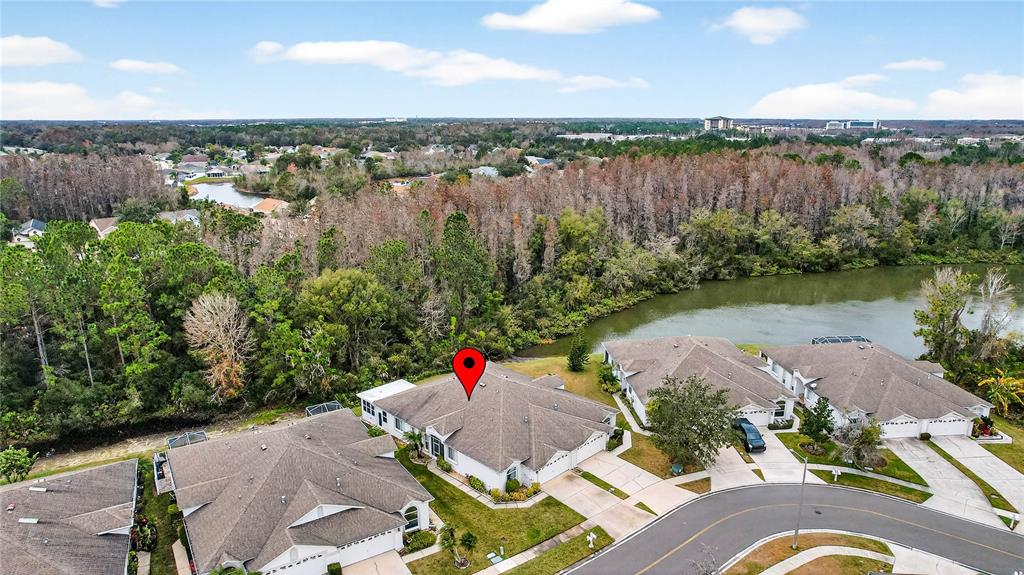 1737 Sassafras Drive Wesley Chapel, FL 33543 - Photo 42 of 58 an aerial view of a house with outdoor space and lake view in back