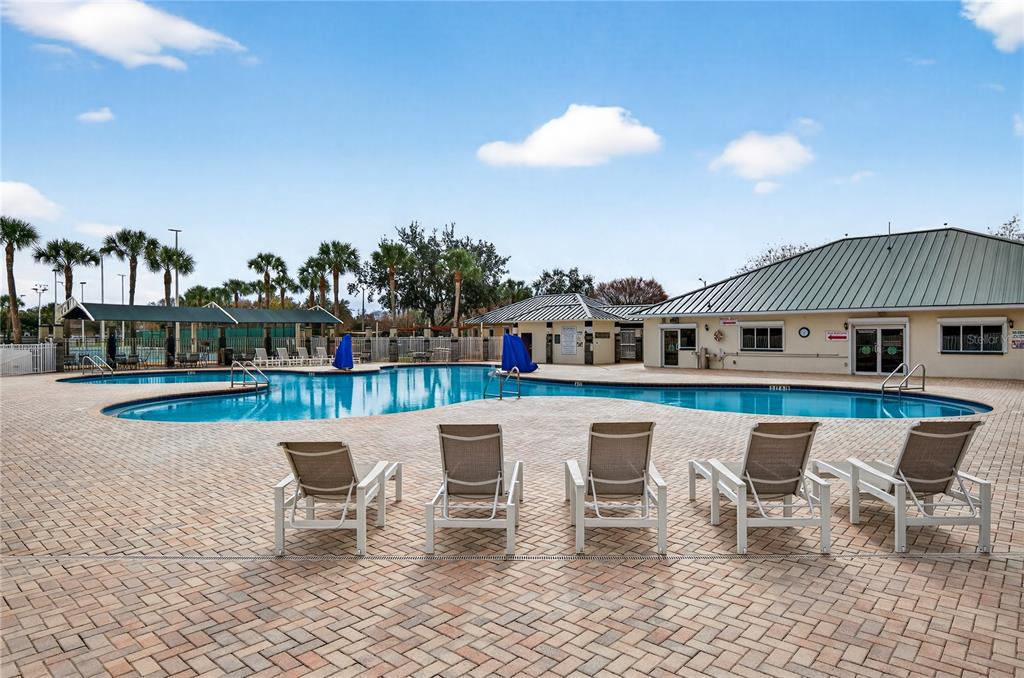 1737 Sassafras Drive Wesley Chapel, FL 33543 - Photo 47 of 58 a roof deck with table and chairs and potted plants