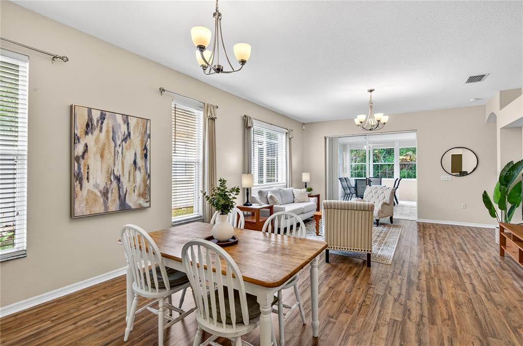 1737 Sassafras Drive Wesley Chapel, FL 33543 - Photo 5 of 58 a view of a dining room with furniture window and wooden floor