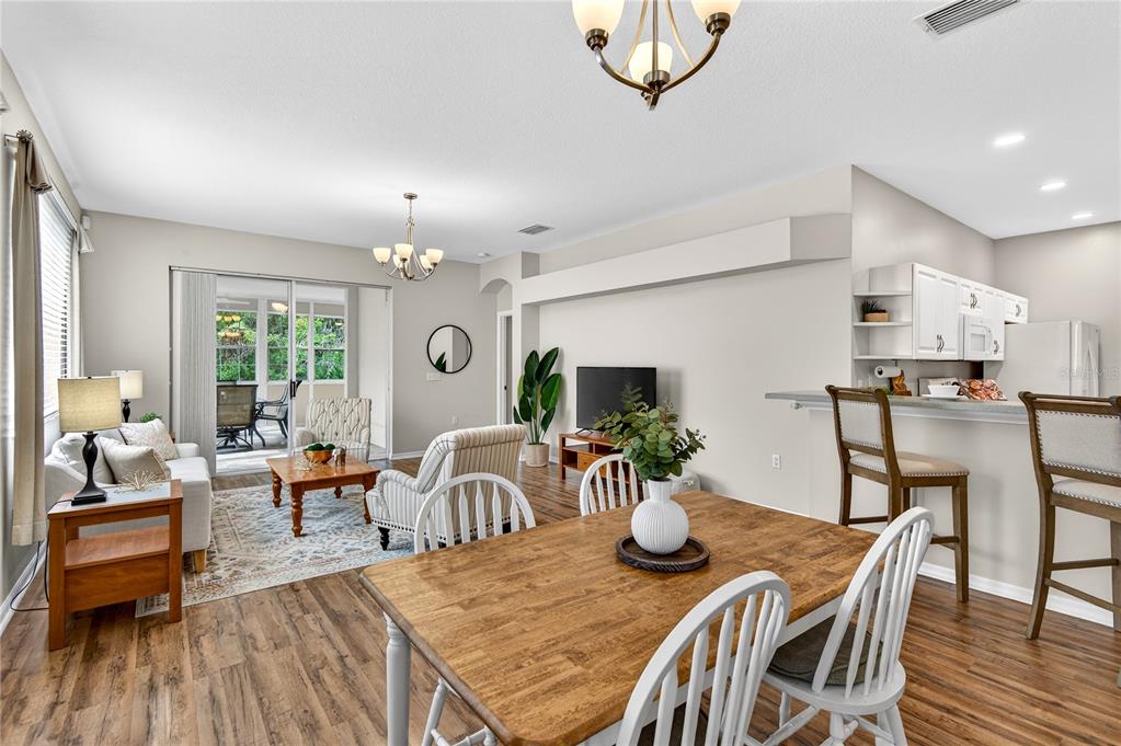 1737 Sassafras Drive Wesley Chapel, FL 33543 - Photo 6 of 58 a view of a dining room with furniture window and wooden floor