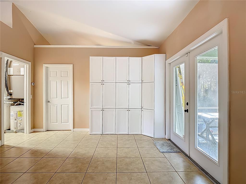 2730 68th Avenue Northeast Naples, FL 34120 - Photo 17 of 86 a view of a livingroom with an empty space and a window