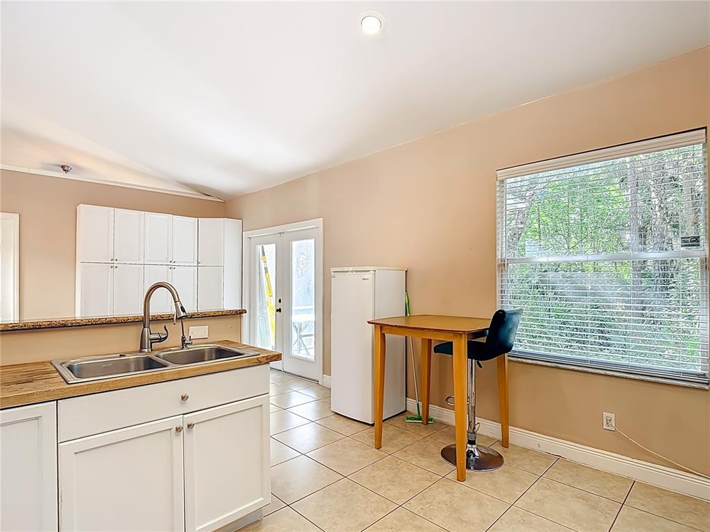 2730 68th Avenue Northeast Naples, FL 34120 - Photo 24 of 86 a view of a kitchen with a sink cabinets and a window