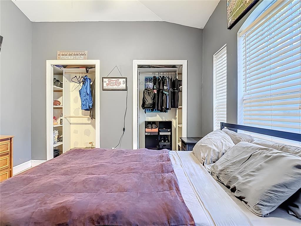 2730 68th Avenue Northeast Naples, FL 34120 - Photo 37 of 86 a bedroom with a large bed and a large mirror