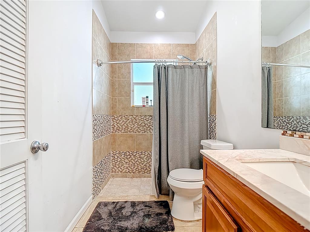 2730 68th Avenue Northeast Naples, FL 34120 - Photo 41 of 86 a bathroom with a sink toilet and shower