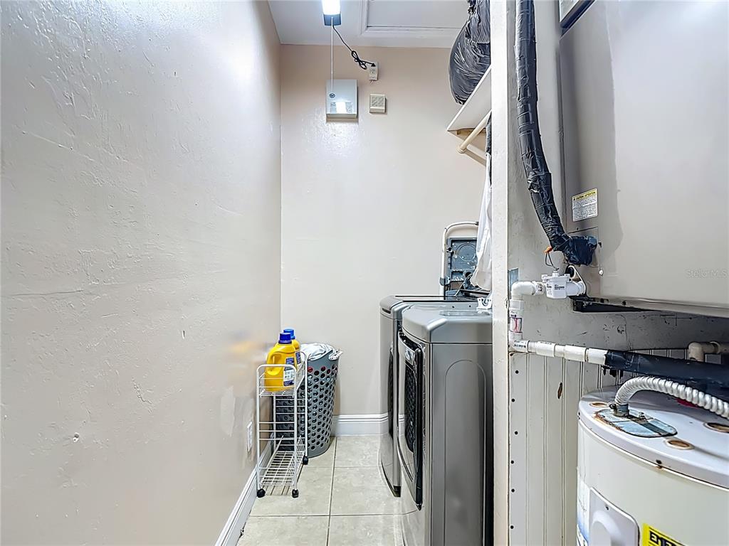 2730 68th Avenue Northeast Naples, FL 34120 - Photo 49 of 86 a utility room with dryer and washer