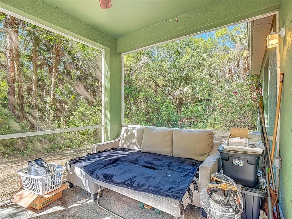 2730 68th Avenue Northeast Naples, FL 34120 - Photo 51 of 86 a living room with a couch and a large window