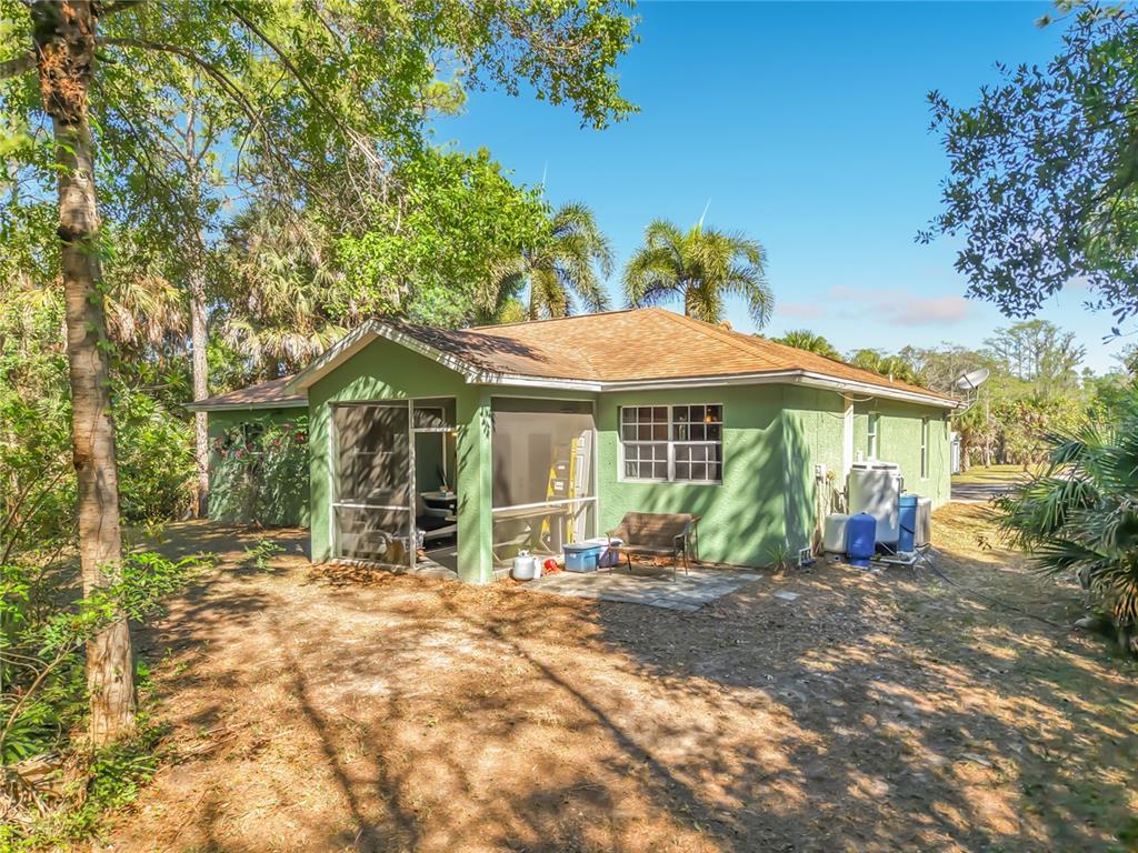 2730 68th Avenue Northeast Naples, FL 34120 - Photo 54 of 86 a view of a house with a patio