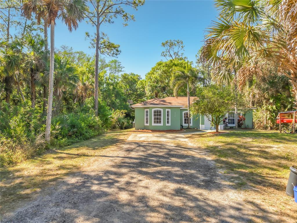2730 68th Avenue Northeast Naples, FL 34120 - Photo 58 of 86 a view of a trees in front of a house