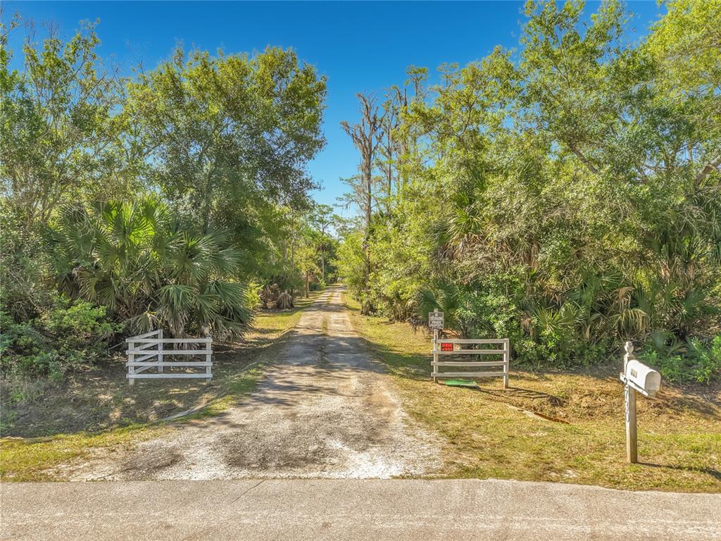 2730 68th Avenue Northeast Naples, FL 34120 - Photo 62 of 86 a backyard of a house with outdoor seating