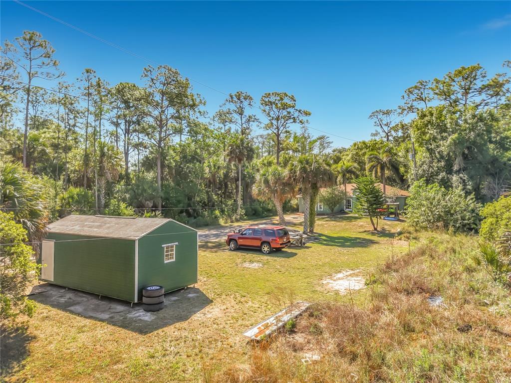 2730 68th Avenue Northeast Naples, FL 34120 - Photo 65 of 86 a view of a house with a yard