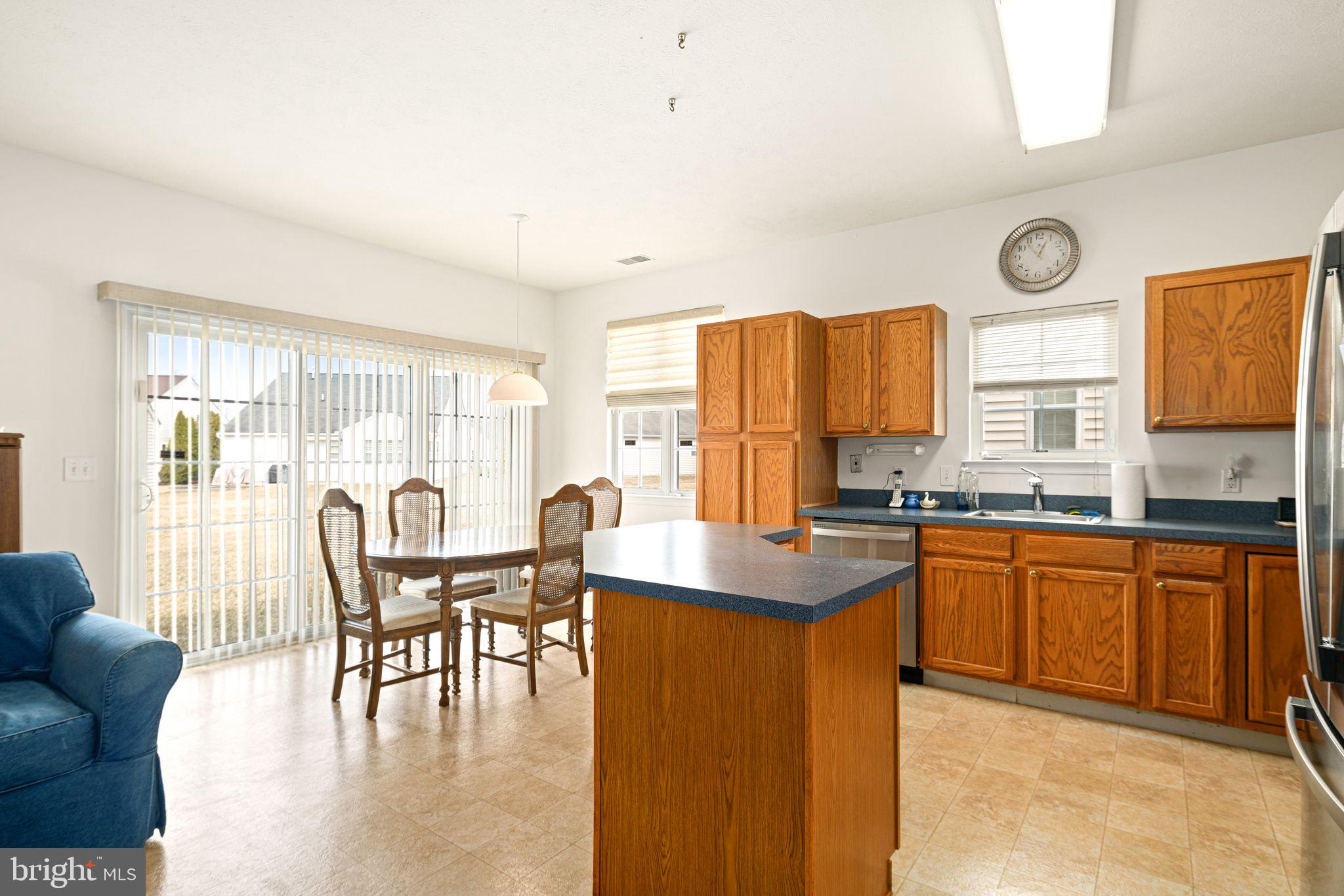 3 Fairfield Drive Westampton, NJ 08060 - Photo 11 of 36 a kitchen with stainless steel appliances granite countertop a stove a refrigerator a kitchen island a dining table and chairs