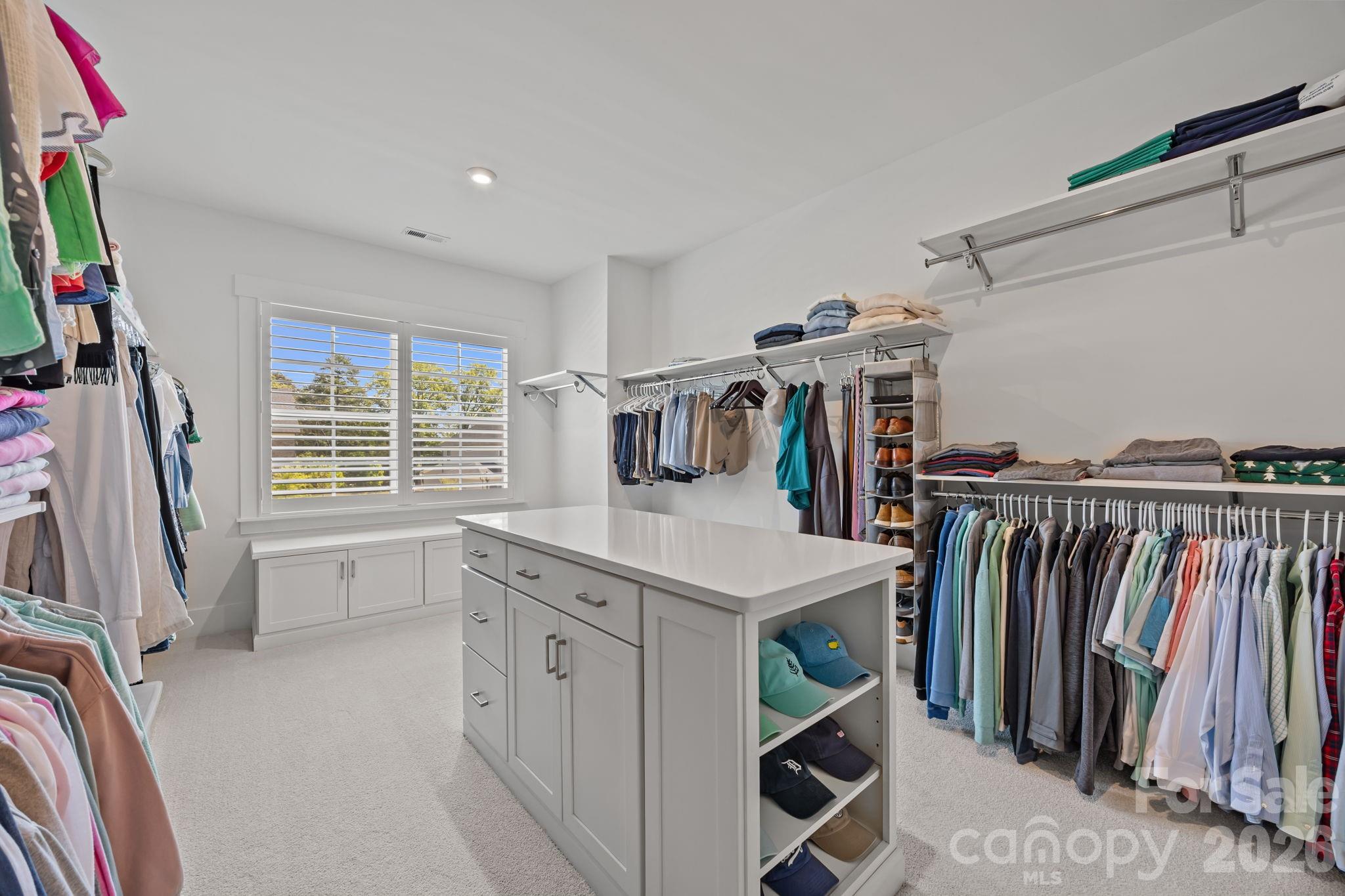 8620 Balcony Bridge Road Huntersville, NC 28078 - Photo 32 of 48 a view of walk in closet with clothes and shoes