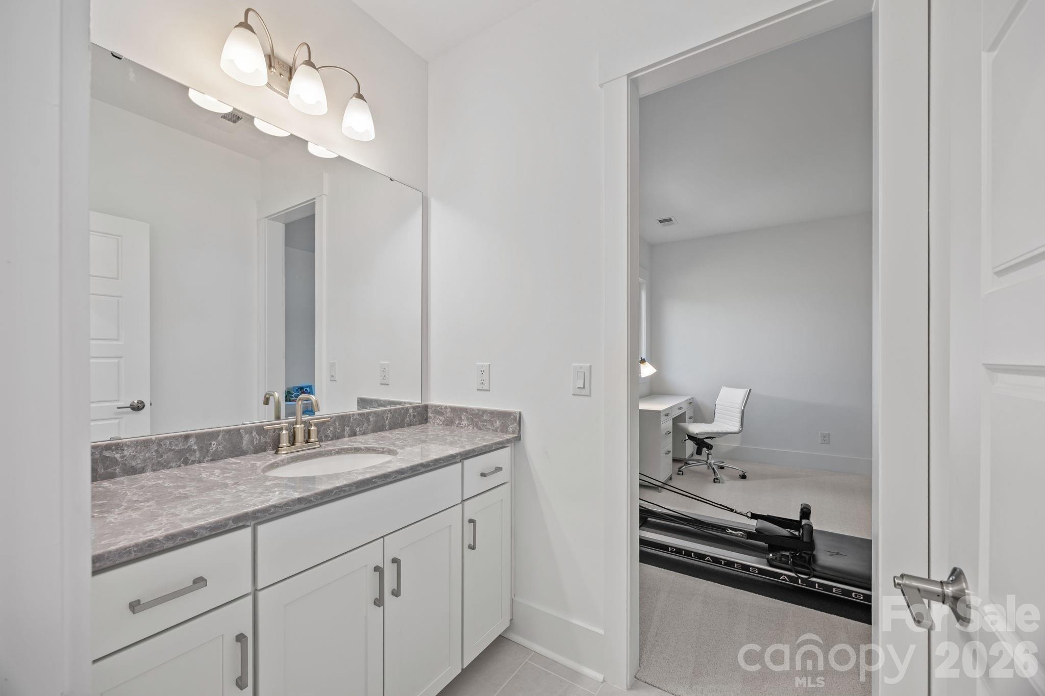8620 Balcony Bridge Road Huntersville, NC 28078 - Photo 38 of 48 a bathroom with a granite countertop double vanity sink and a mirror