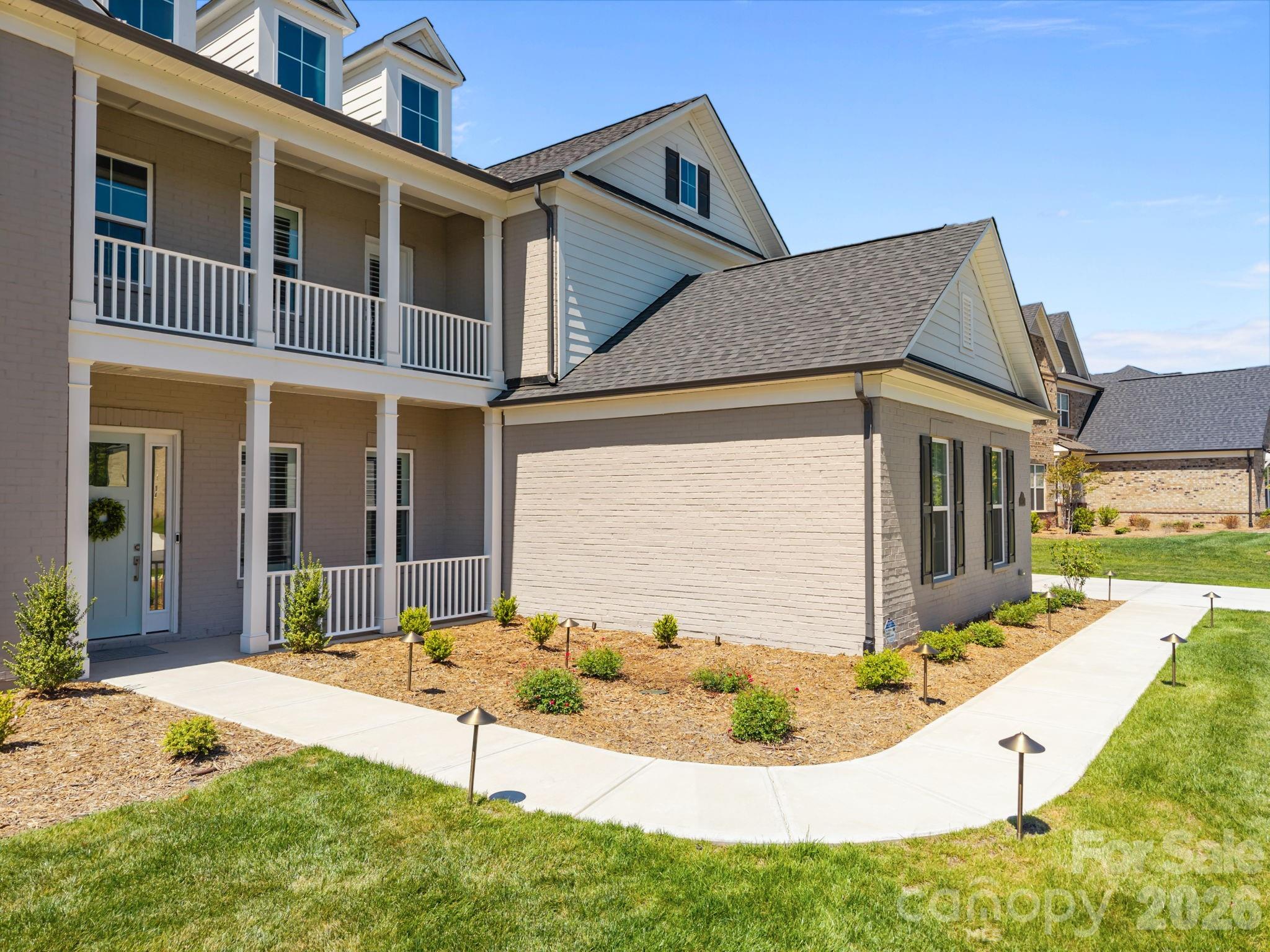 8620 Balcony Bridge Road Huntersville, NC 28078 - Photo 4 of 48 a front view of a house with a yard