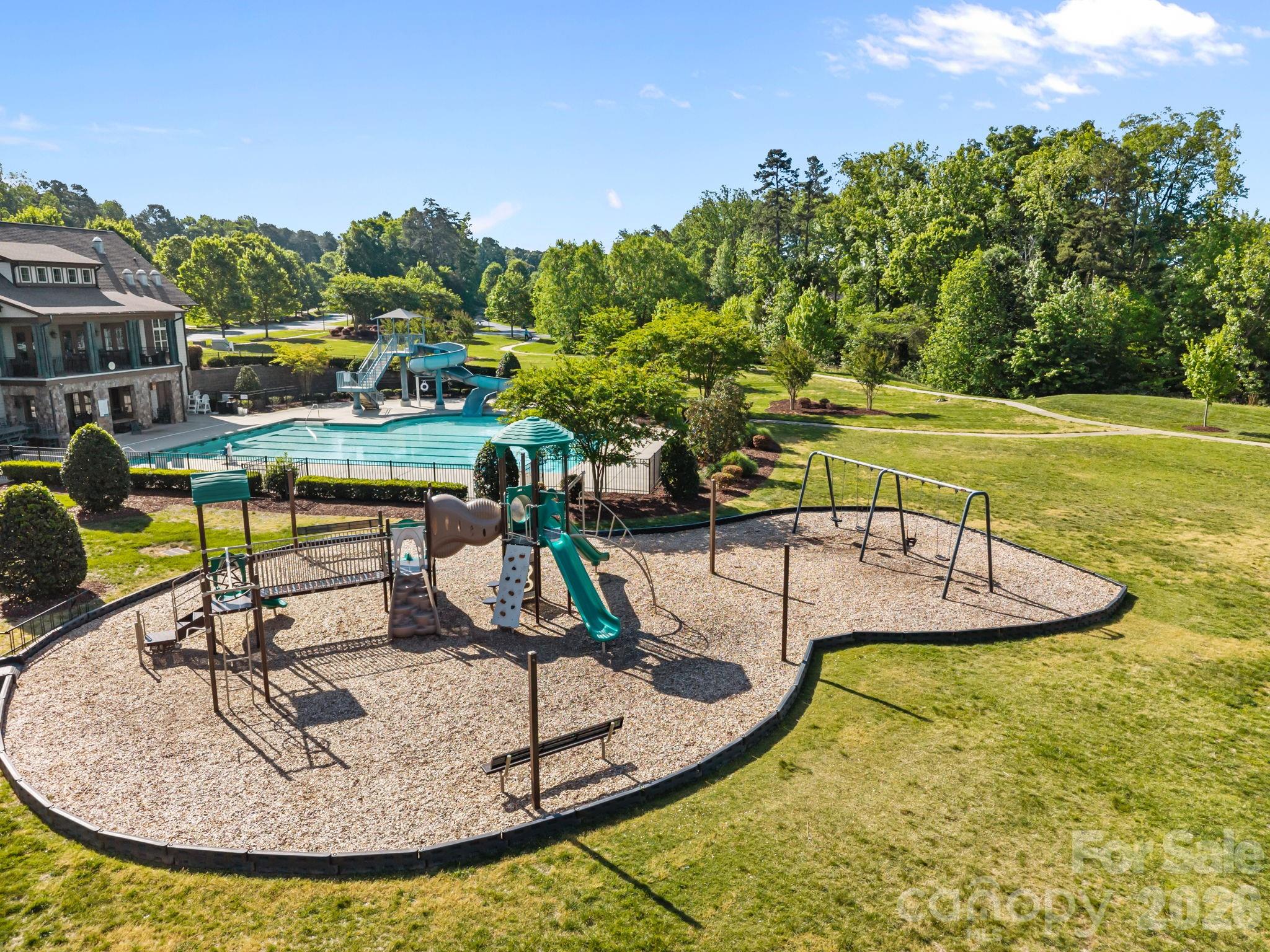 8620 Balcony Bridge Road Huntersville, NC 28078 - Photo 45 of 48 a view of a swimming pool with a table and chairs