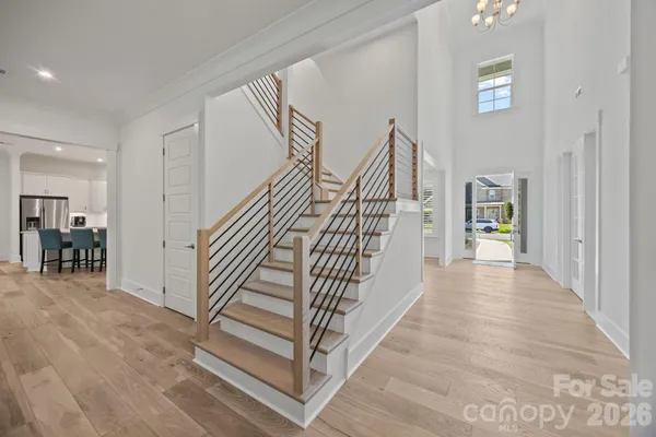 a view of entryway and hall with wooden floor