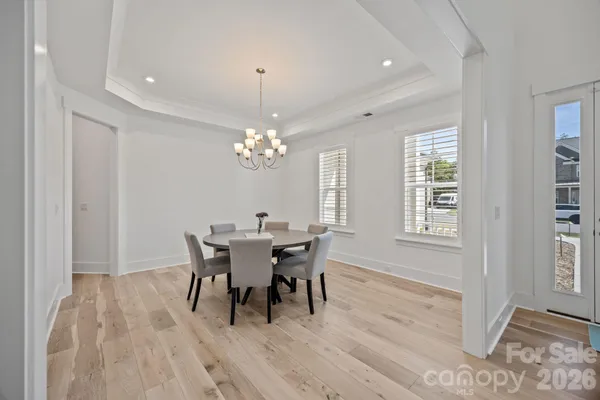 a view of a dining room with furniture and window