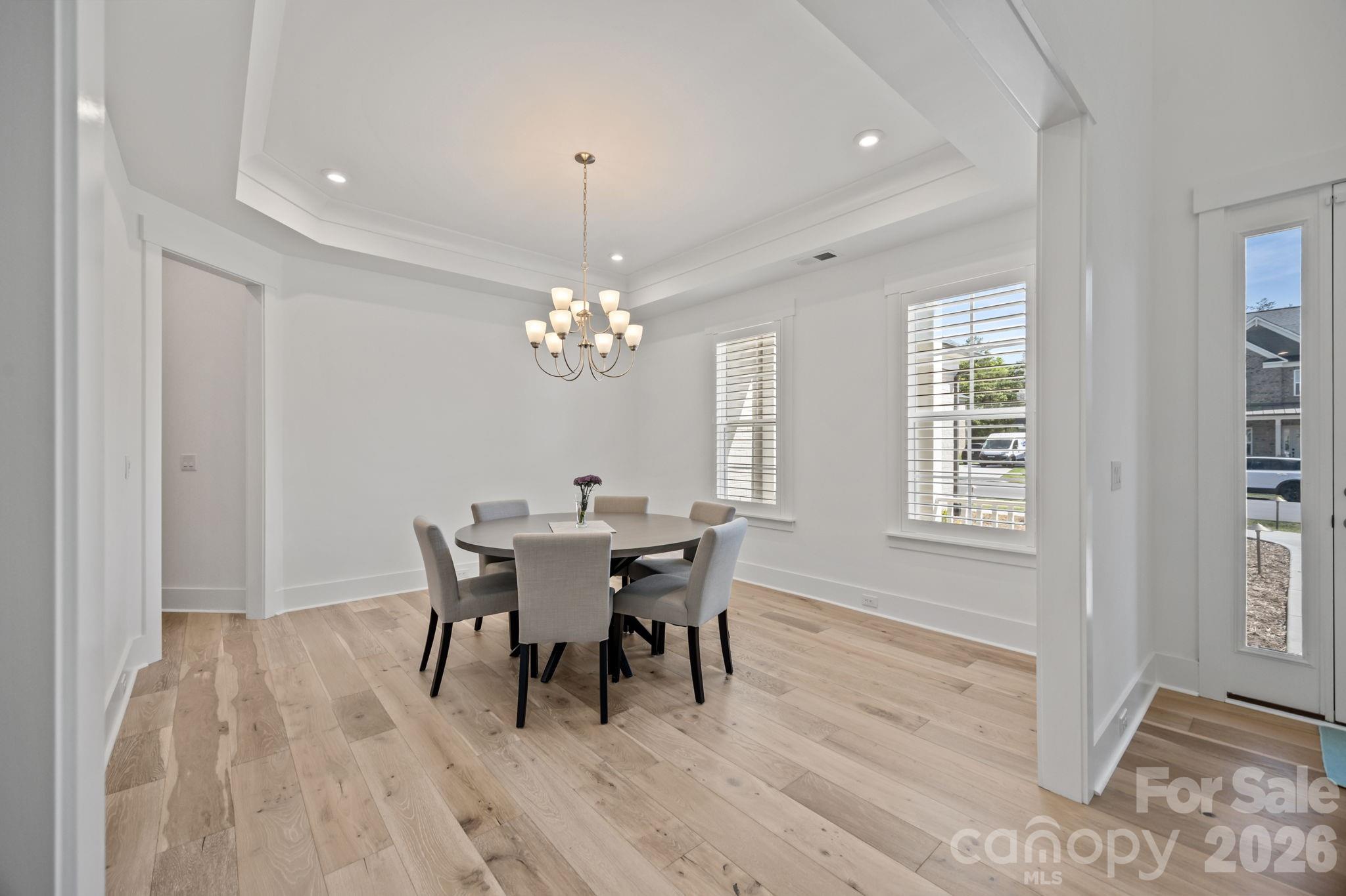 8620 Balcony Bridge Road Huntersville, NC 28078 - Photo 9 of 48 a view of a dining room with furniture and window