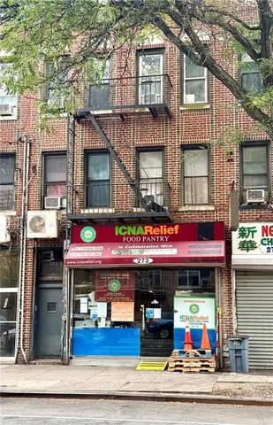 a front view of a building with retail shops