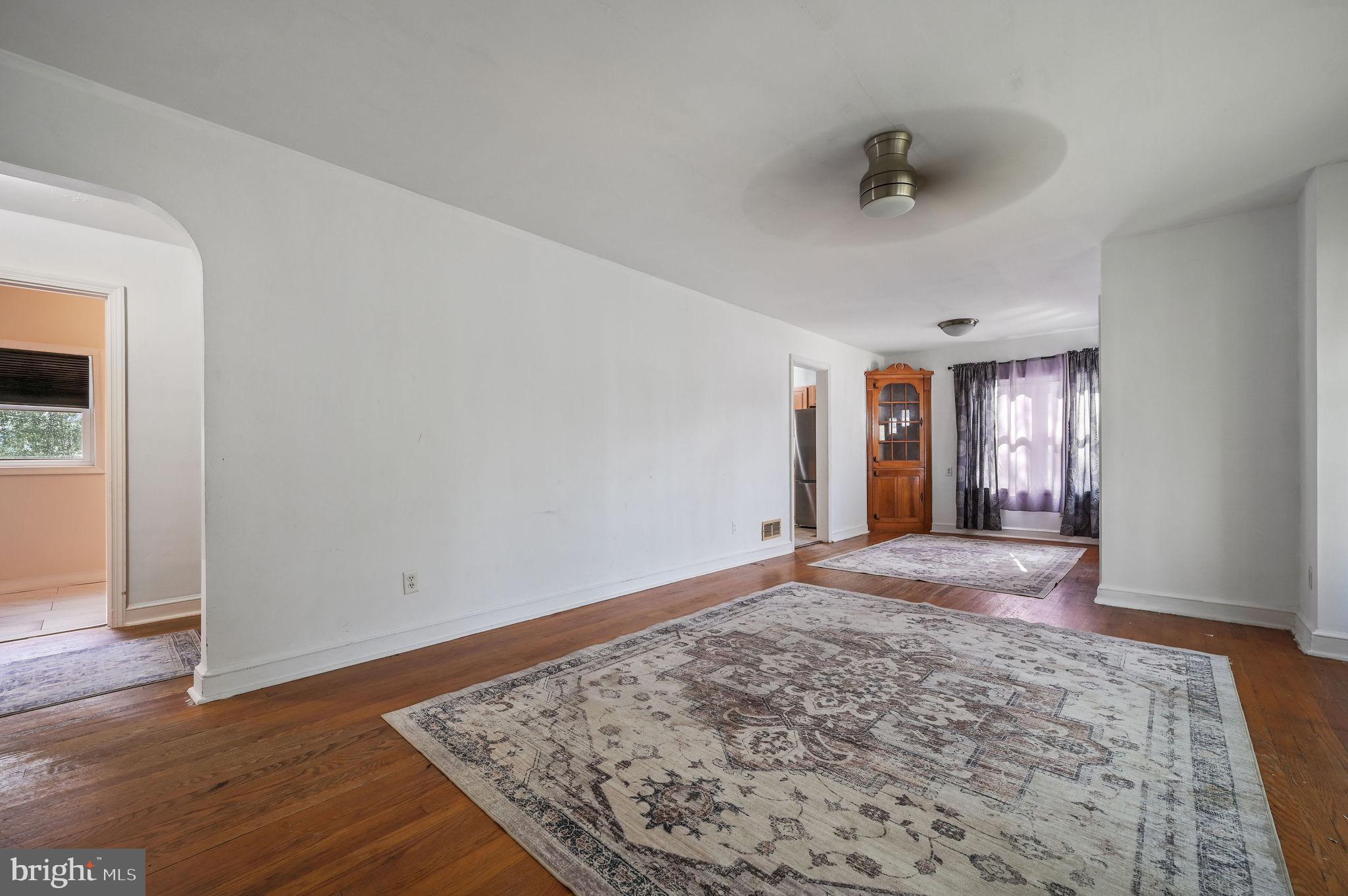 10 North Main Street Magnolia, DE 19962 - Photo 11 of 26 an empty room with wooden floor and windows