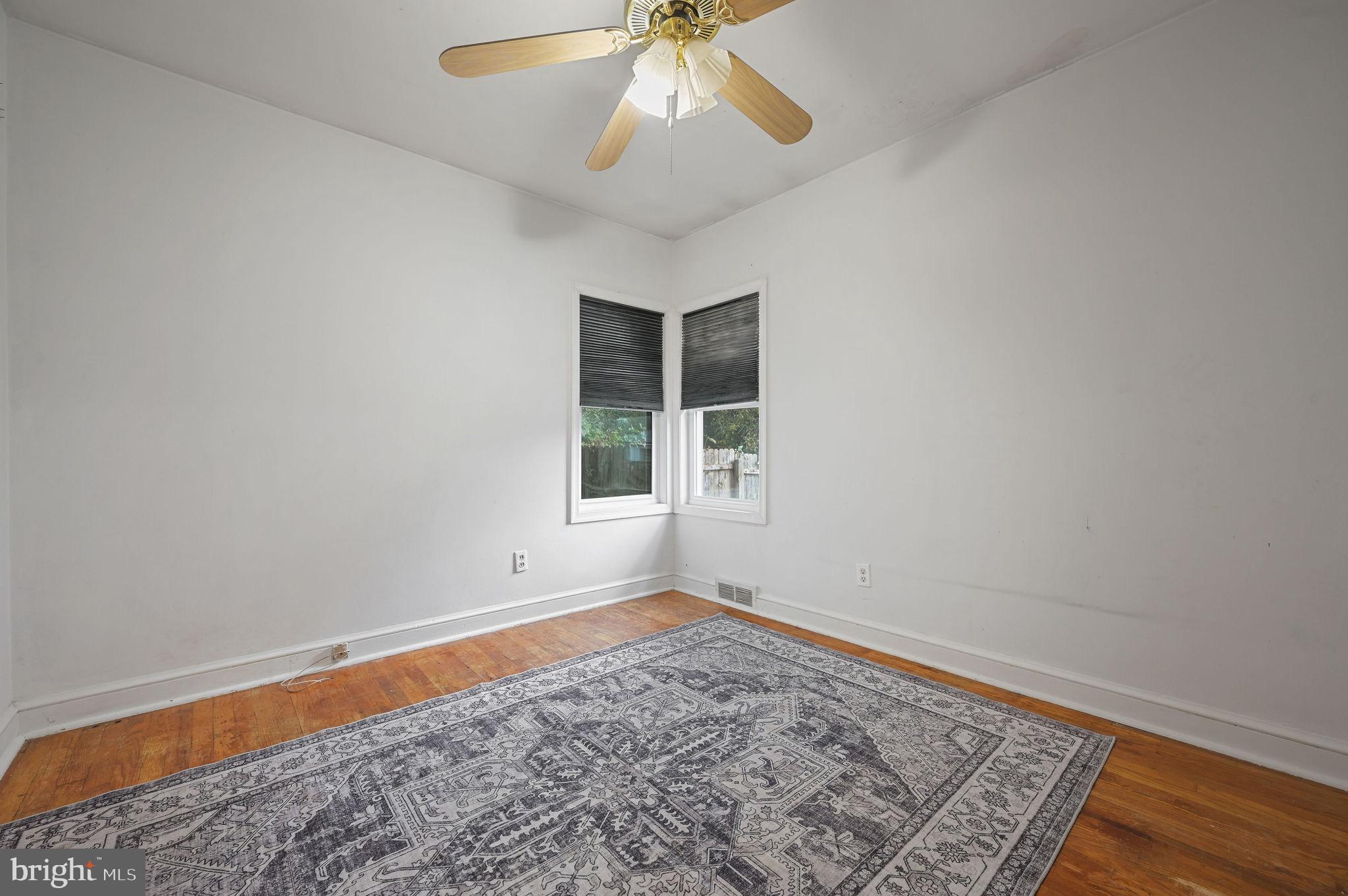 10 North Main Street Magnolia, DE 19962 - Photo 16 of 26 wooden floor in an empty room with a window
