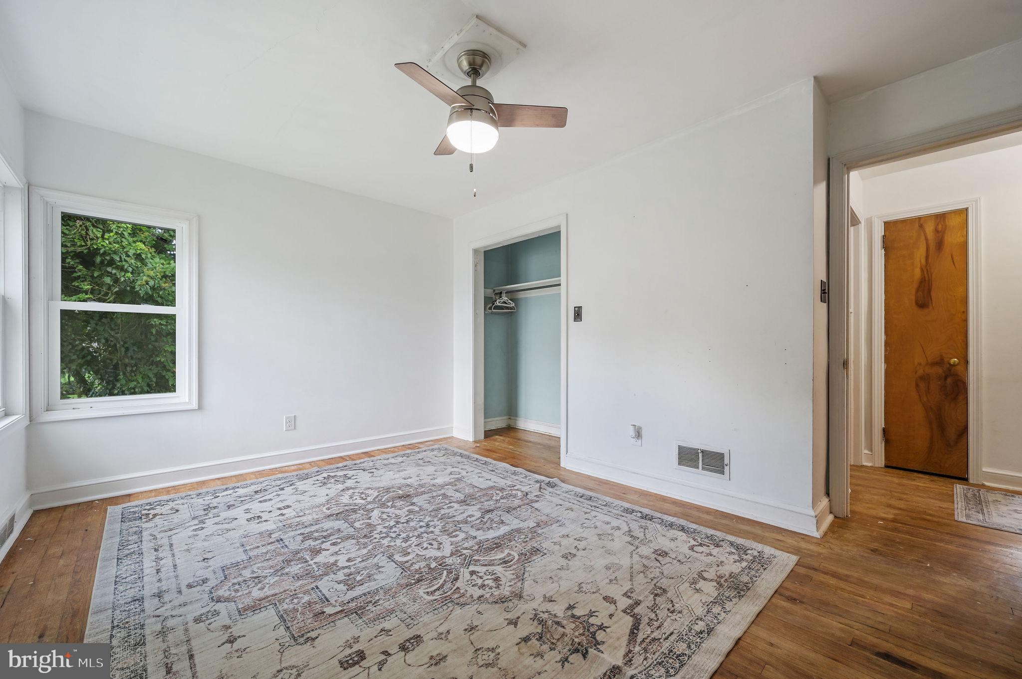 10 North Main Street Magnolia, DE 19962 - Photo 18 of 26 wooden floor in an empty room with a window