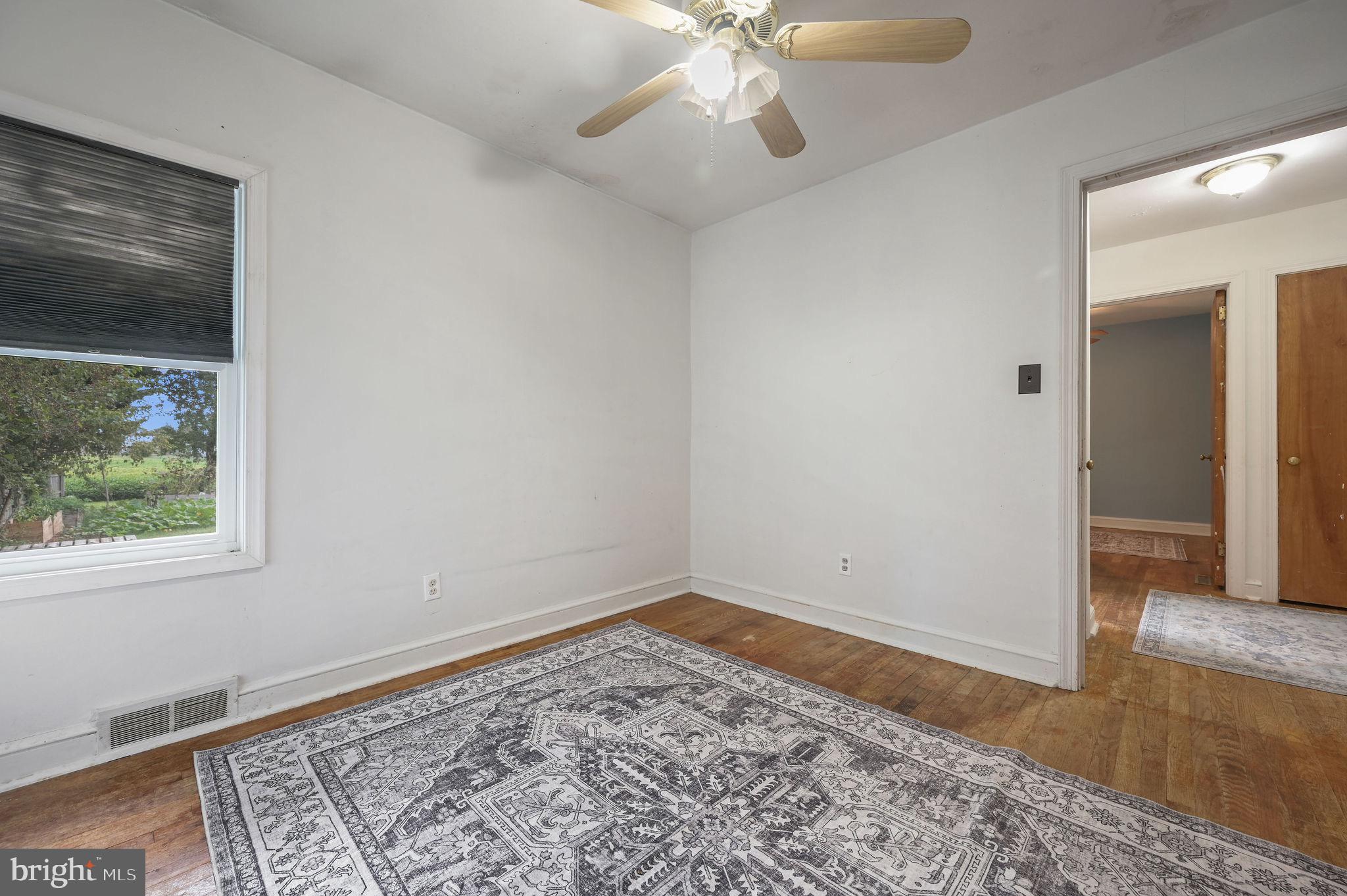 10 North Main Street Magnolia, DE 19962 - Photo 21 of 26 wooden floor in an empty room with a window