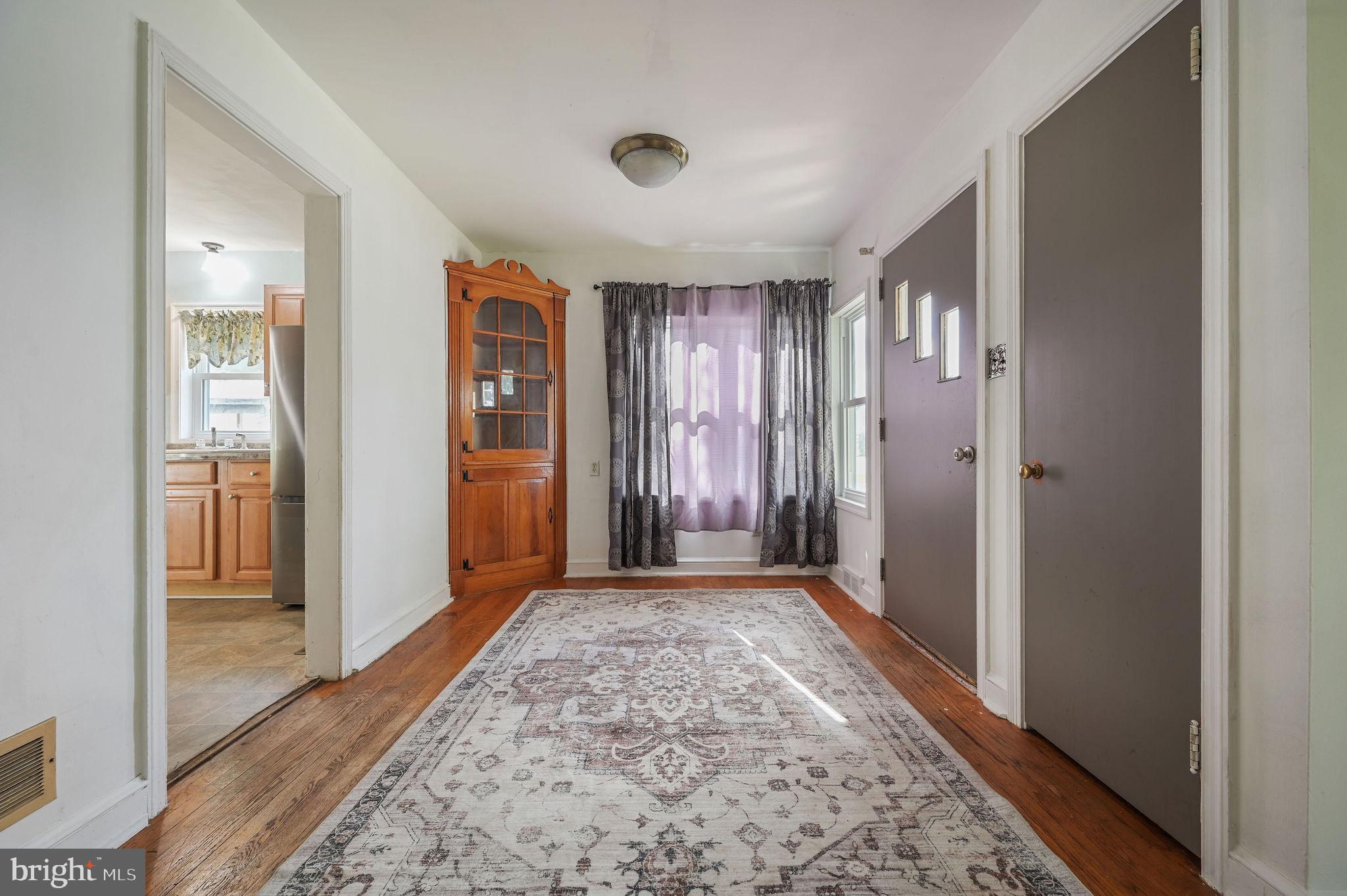 10 North Main Street Magnolia, DE 19962 - Photo 8 of 26 wooden floor with a chandelier