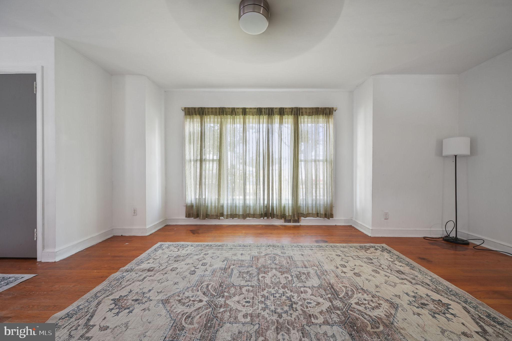 10 North Main Street Magnolia, DE 19962 - Photo 9 of 26 a view of an empty room with window and wooden floor