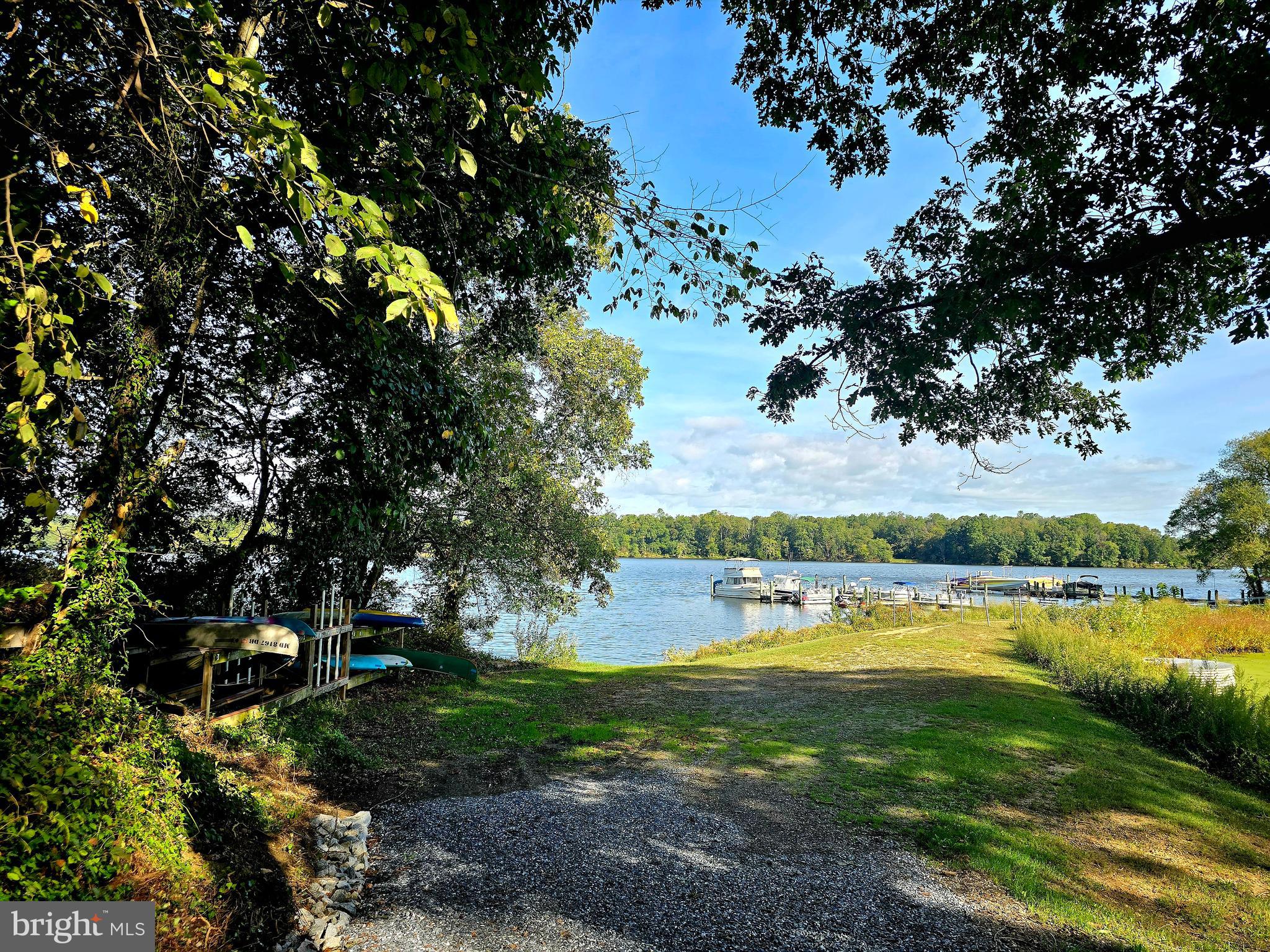 a view of a lake with houses in the back