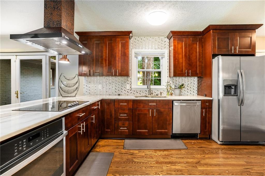 2653 Preston Drive Decatur, GA 30034 - Photo 1 of 1 a kitchen with stainless steel appliances granite countertop a sink stove and refrigerator