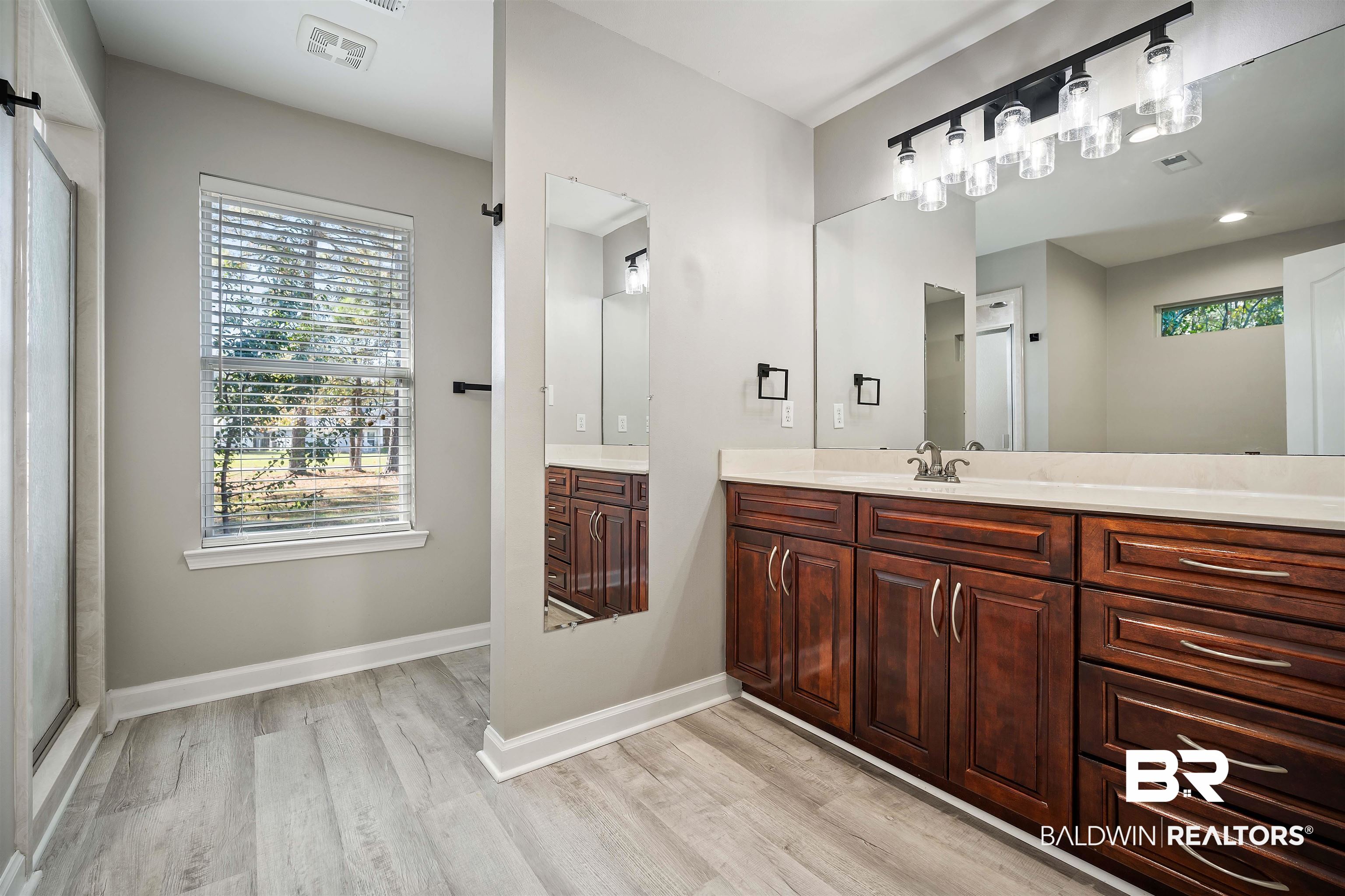 3010 Drag Strip Lane Coden, AL 36523 - Photo 18 of 44 Bathroom featuring hardwood / wood-style floors, vanity, and a shower