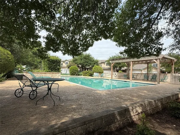 a view of a house with backyard porch and sitting area