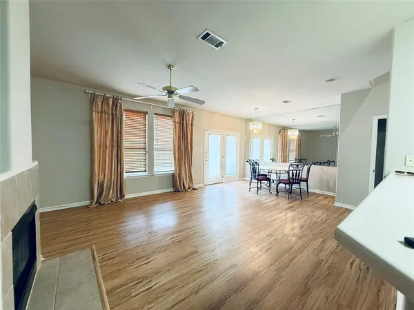 a view of a livingroom with furniture and wooden floor