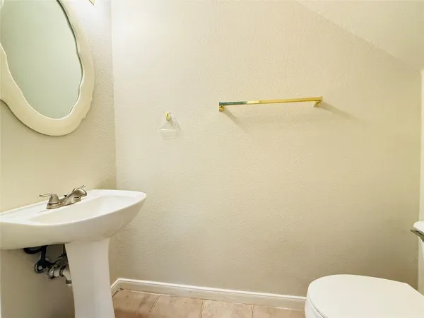 a bathroom with a sink a mirror and a toilet