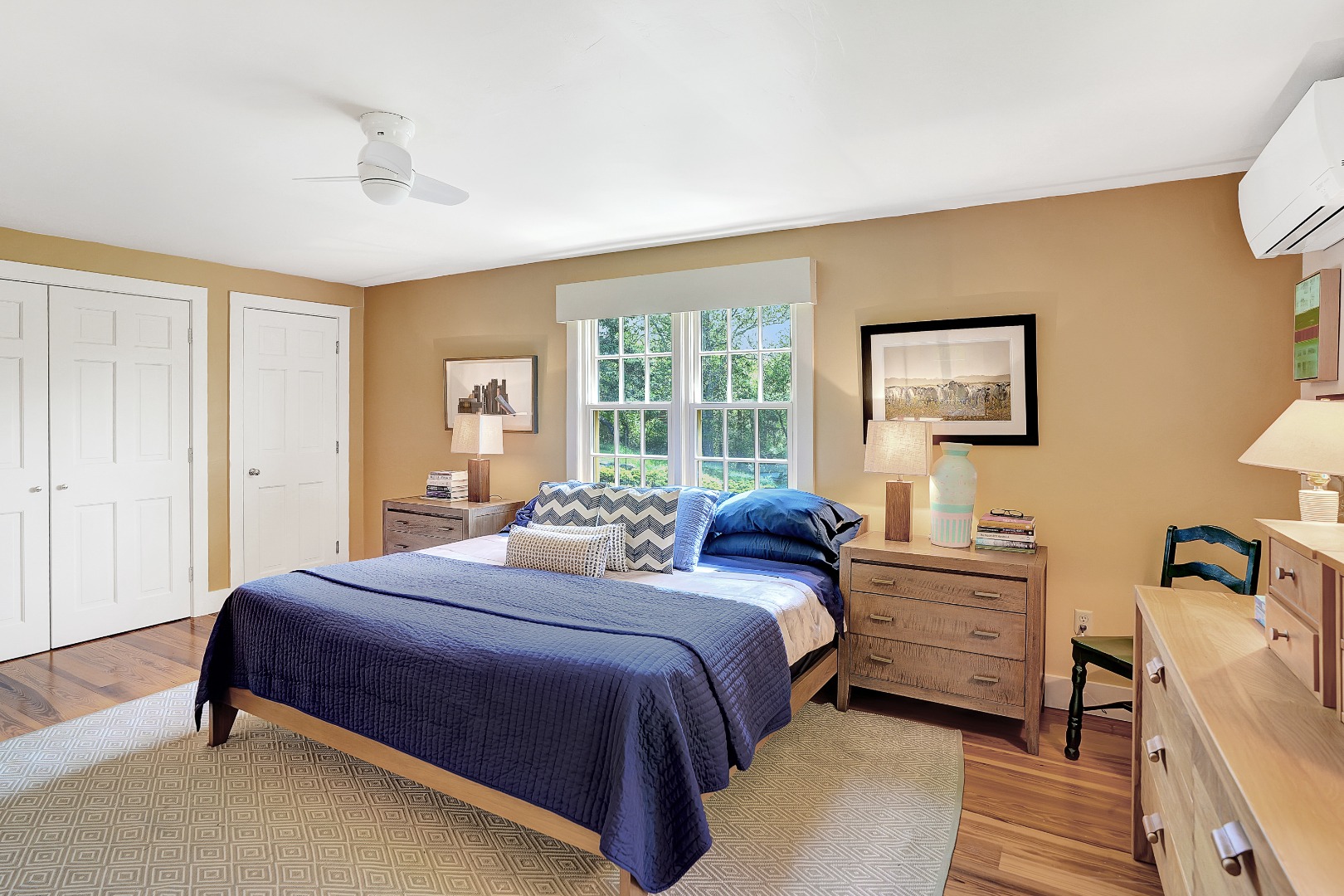 122 Old Farm Road Chilmark, MA 02535 - Photo 21 of 36 a bedroom with a bed and a dresser next to a window