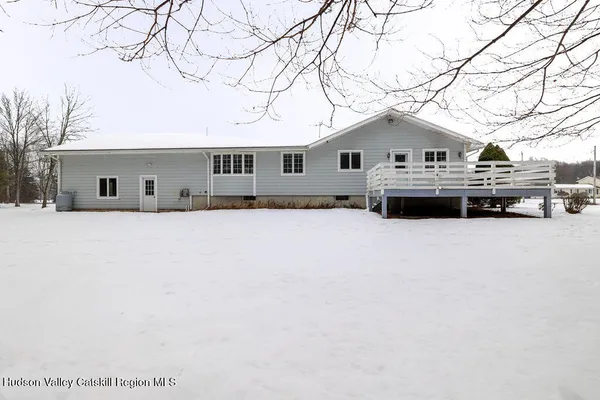 a house with a tree in front of it
