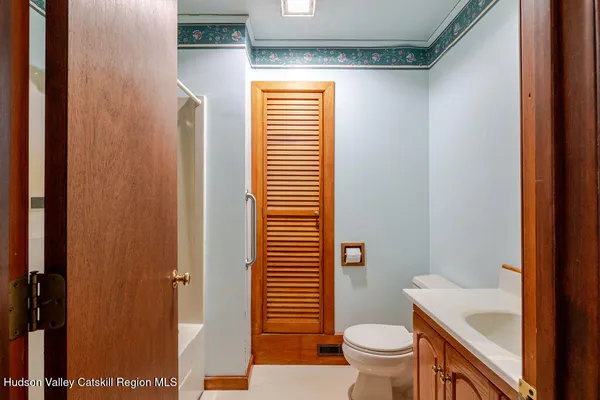 a bathroom with a toilet a sink and a shower
