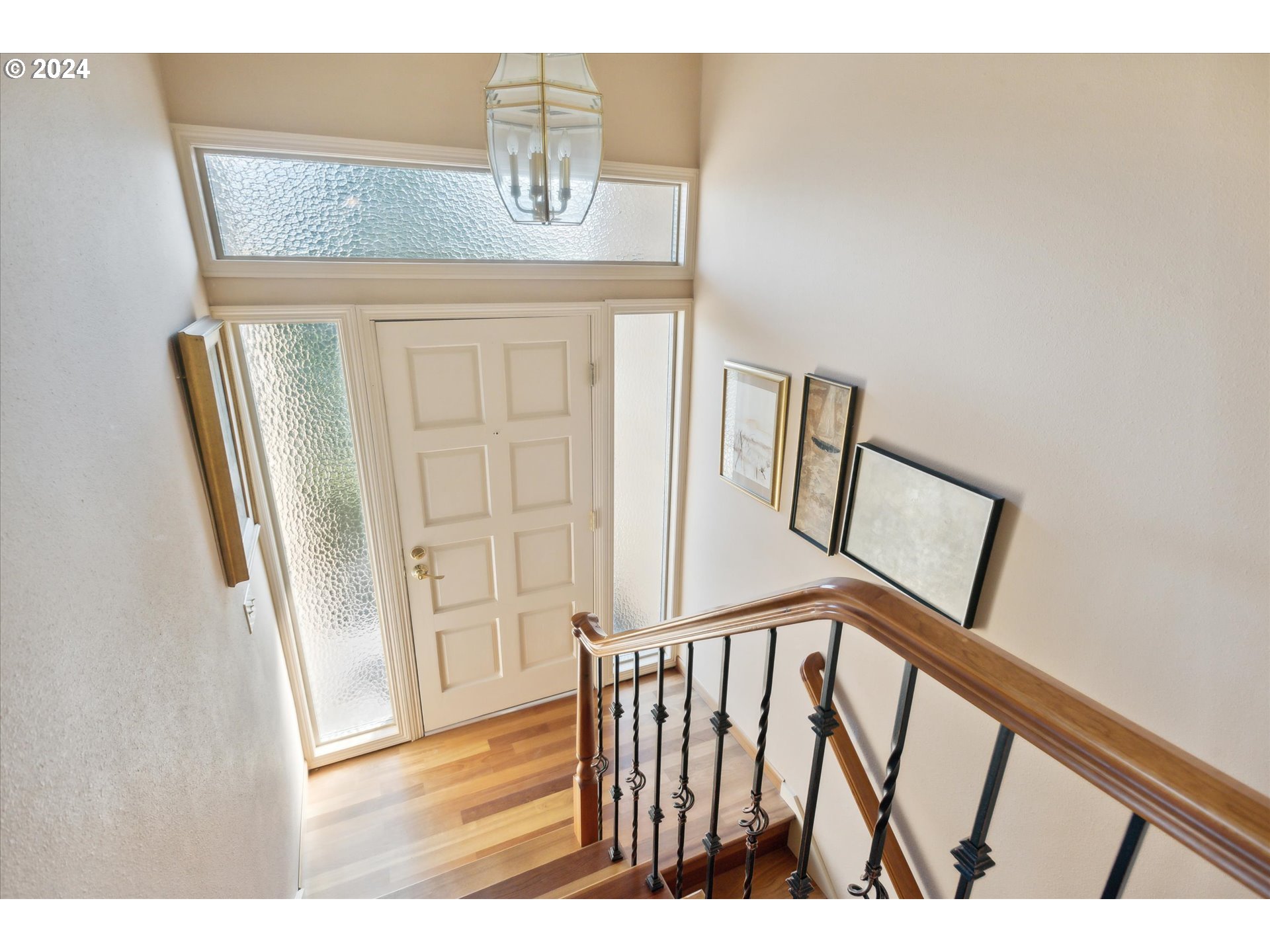 8027 Southwest Ruby Terrace Portland, OR 97219 - Photo 3 of 30 a view of staircase with railing and white walls