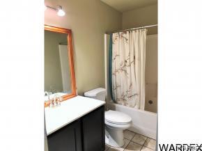 737 Heber Road Golden Valley, AZ 86413 - Photo 12 of 26 a bathroom with a sink a toilet and shower