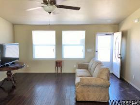 737 Heber Road Golden Valley, AZ 86413 - Photo 4 of 26 a living room with couches and a window with wooden floor
