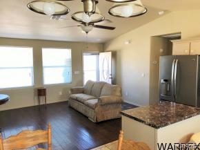 737 Heber Road Golden Valley, AZ 86413 - Photo 5 of 26 a living room with kitchen island furniture and a window