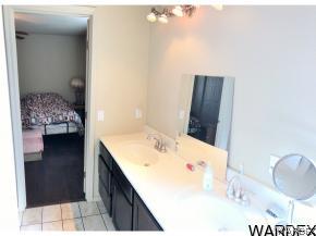 737 Heber Road Golden Valley, AZ 86413 - Photo 8 of 26 a en suite bathroom with a sink and a mirror