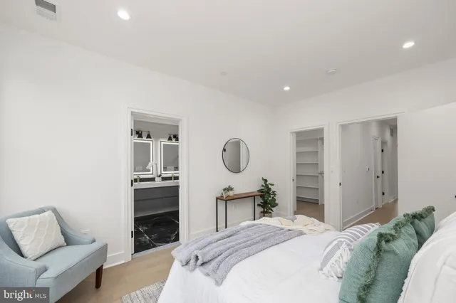 a bedroom with a bed and a couch