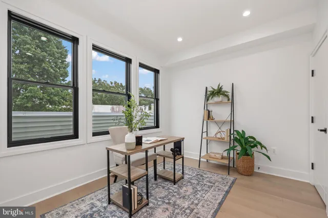 a workspace with furniture and a potted plant