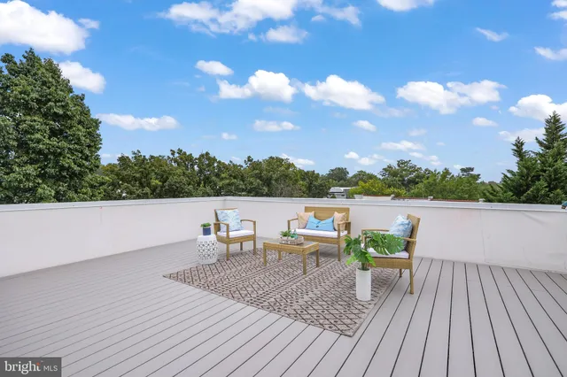 a view of roof deck with seating space